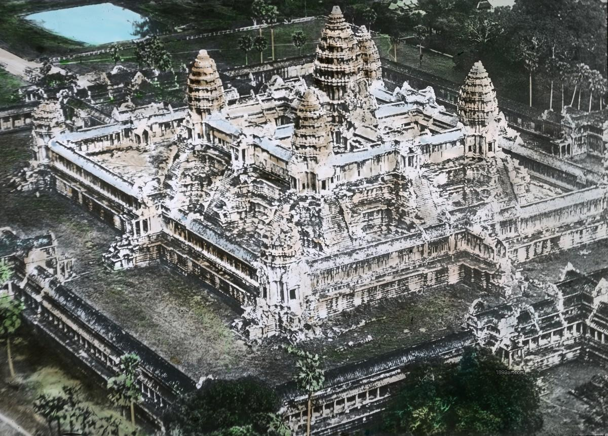 Angkor Wat complex with stone towers and surrounding trees, seen from above