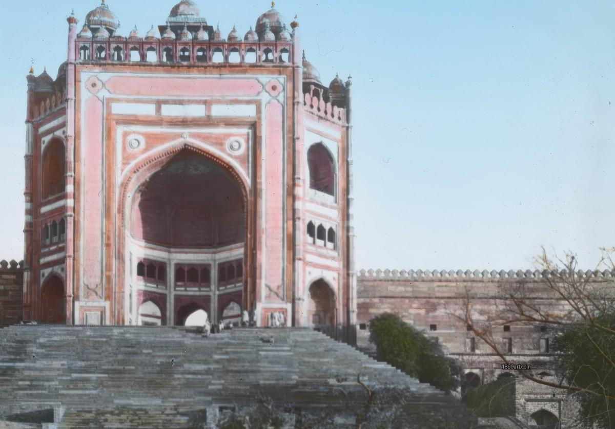 Hand-colored Mughal gateway with wide steps, arches, and fortified wall