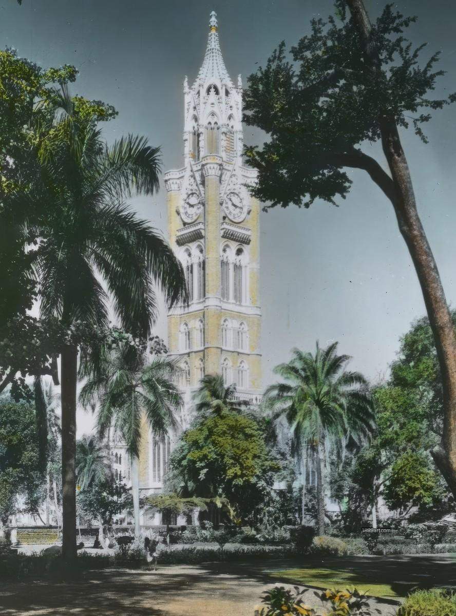 Rajabai Clock Tower above palms and trees, with clock faces visible