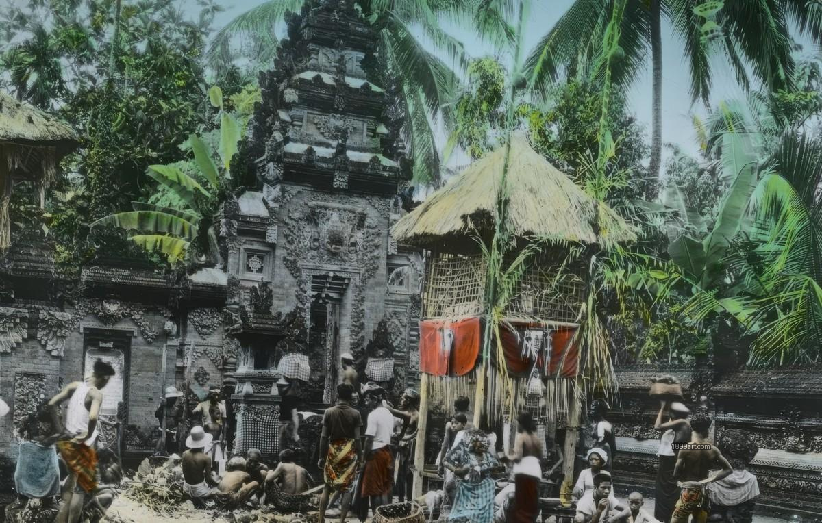 People in traditional dress gather at a carved stone temple entrance