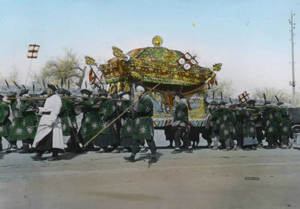 China Quing Dynasty Men in green robes carry an ornate palanquin along a road
