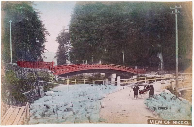 1899art Japan, Shinkyō Bridge, Nikko – Approach Road with Kago Bearers Handcolored 1900s 1899art. Historical photograph from the 1899art Archive.