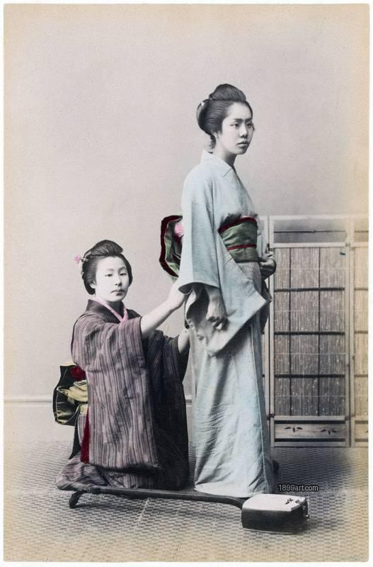1899art Young Female Musician (Seiren) Being Dressed (Studio Scene) Japan, c. 1890s Handcolored 1899art. Historical photograph from the 1899art Archive.