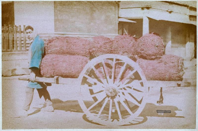 1899art Man Pulling a Handcart Loaded with Straw Bales, Japan Handcolored 1900s 1899art. Historical photograph from the 1899art Archive.