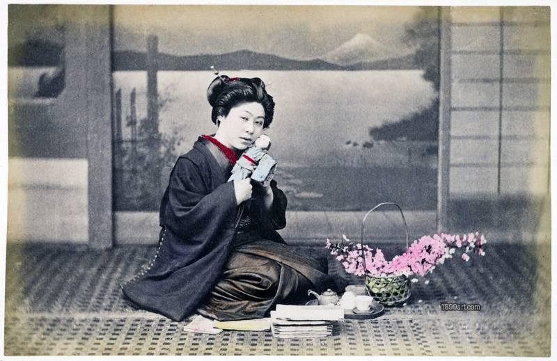 1899art Japan Studio portrait of a young girl with doll and tea set on a patterned rug, Japan, late Meiji period 1899art. Historical photograph from the 1899art Archive.