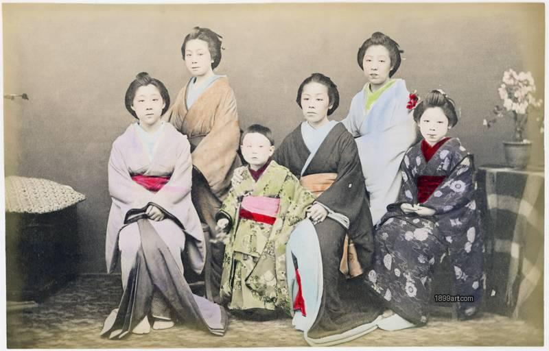 1899art Group Portrait of Meiko with a Young Child – Studio Scene, Japan (Meiji Period, c. 1890s) Handcolored 1899art. Historical photograph from the 1899art Archive.