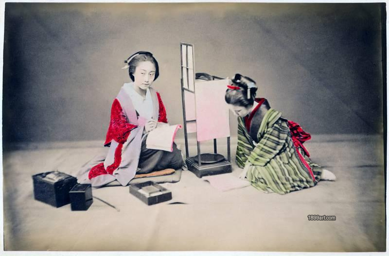 1899art Two Meiko Engaged in Calligraphy Practice – Studio Scene, Japan, c. 1870s–1880s 1899art. Historical photograph from the 1899art Archive.