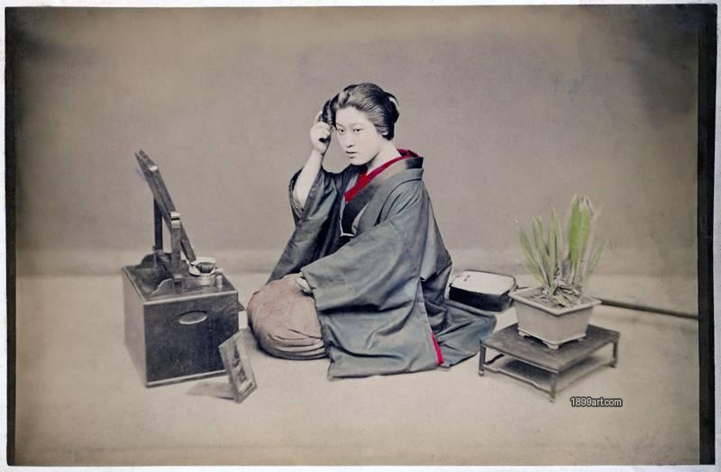 1899art Young Japanese Woman at Her Dressing Table, Meiji Period Handcolored 1900s 1899art. Historical photograph from the 1899art Archive.