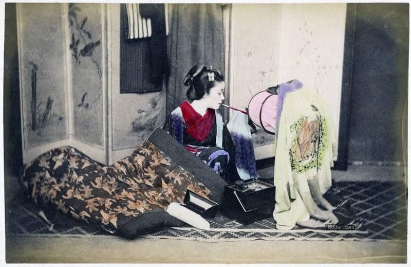 1899art Geisha Lighting a Paper Lantern Handcolored 1900s 1899art. Historical photograph from the 1899art Archive.