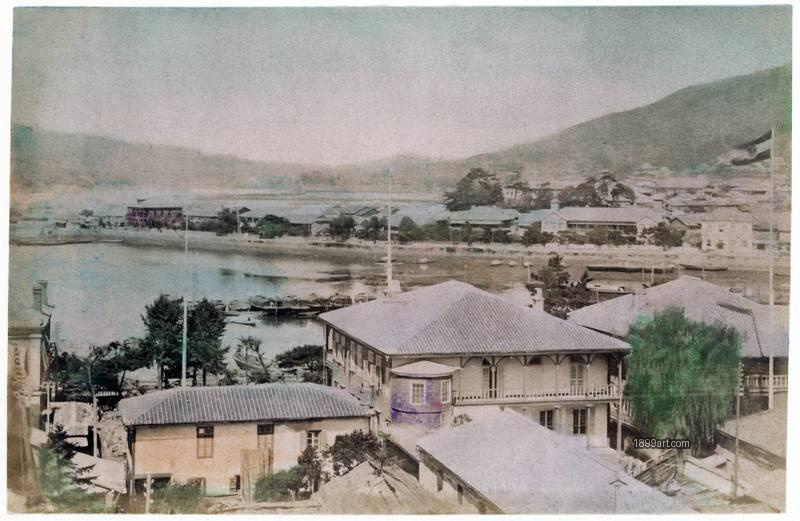 1899art Japan, Dejima, a historic artificial island in Nagasaki Bay and Buildings Handcolored 1900s 1899art. Historical photograph from the 1899art Archive.