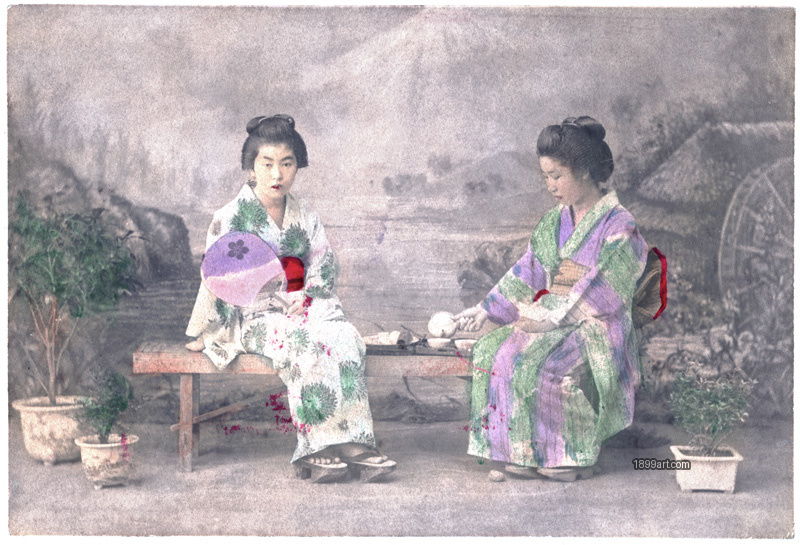 1899art Two Maiko Seated in a Garden Setting, Japan, Meiji Period (c. 1890s) Handcolored 1900s 1899art. Historical photograph from the 1899art Archive.